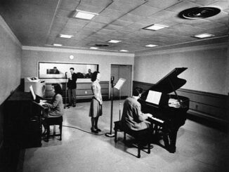 NBC Studio with two pianos and a woman standing at a microphone